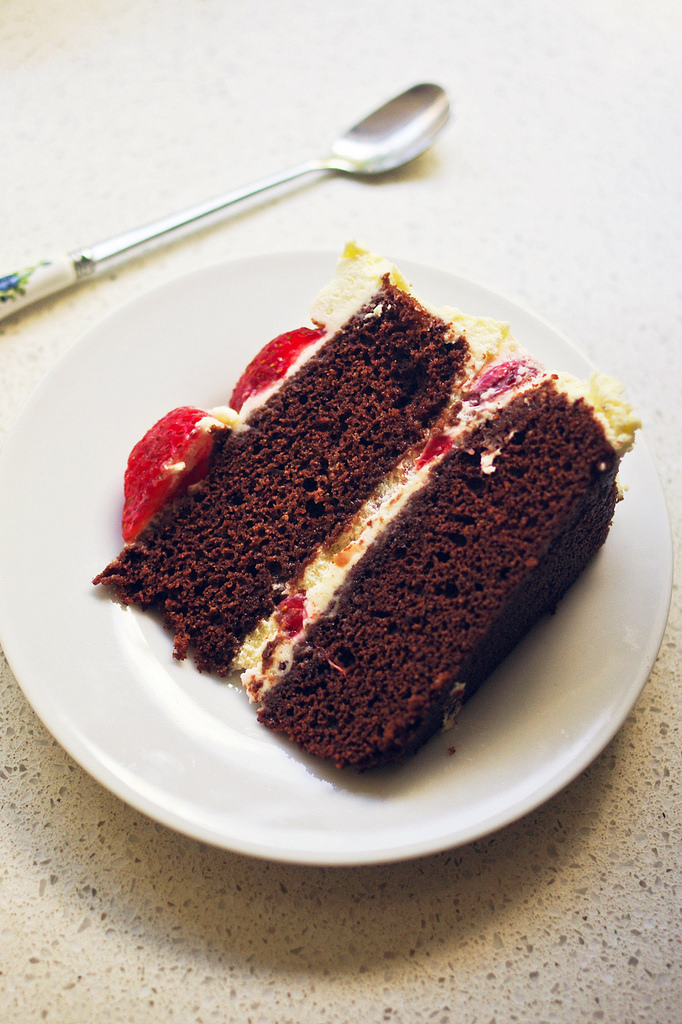 A slice of strawberries chocolate cream cake